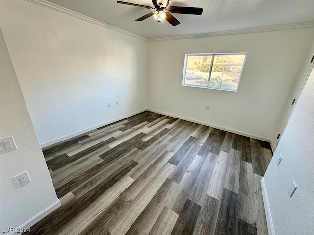 empty room with dark hardwood / wood-style flooring, ceiling fan, and ornamental molding