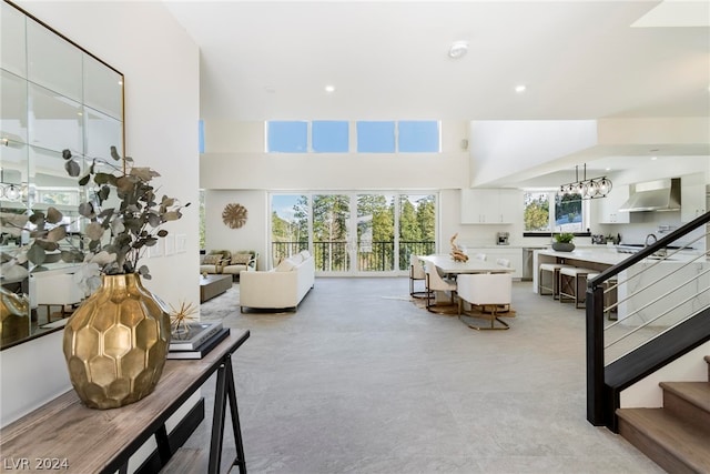 living room featuring a notable chandelier and plenty of natural light