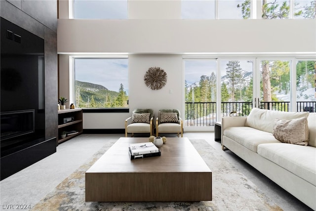 living room featuring a tile fireplace