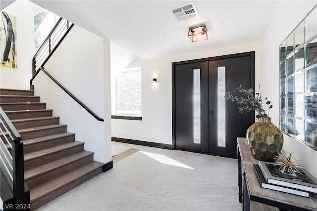 entrance foyer featuring french doors