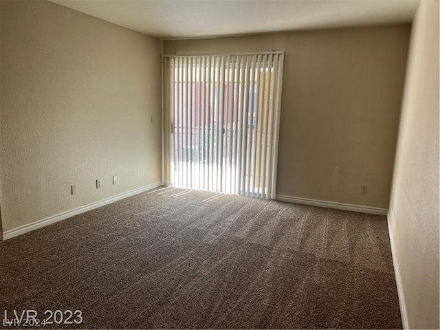 carpeted spare room with a healthy amount of sunlight