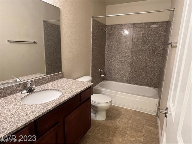 full bathroom featuring vanity, tiled shower / bath combo, tile floors, and toilet