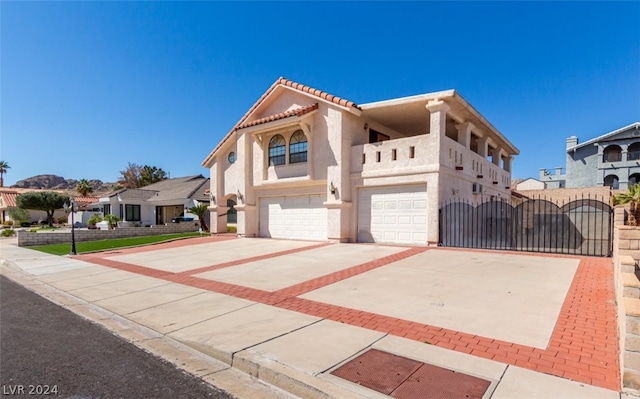 mediterranean / spanish house with a garage