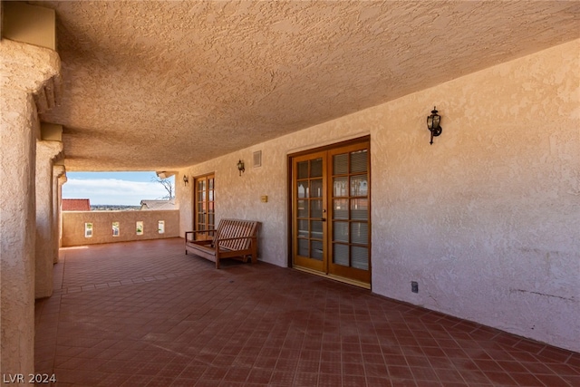 view of terrace featuring french doors