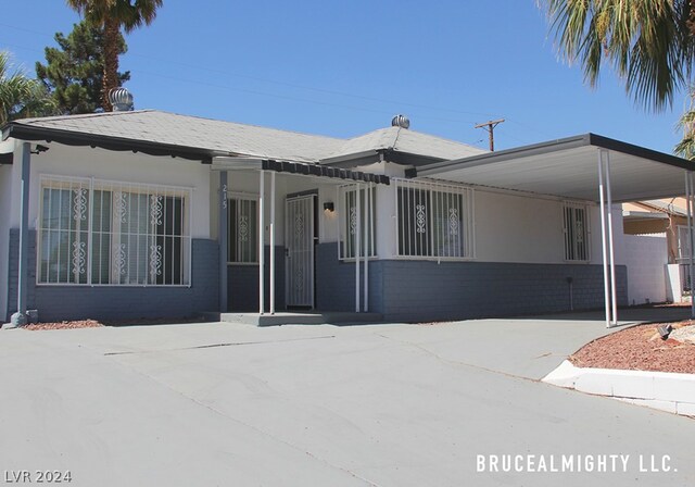 view of front of property with a carport