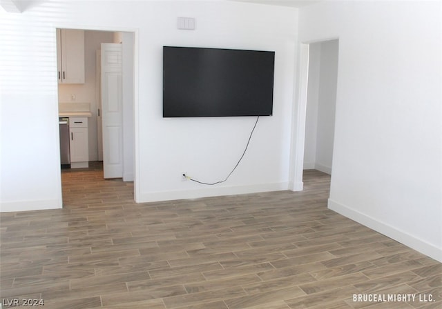 unfurnished living room with hardwood / wood-style floors