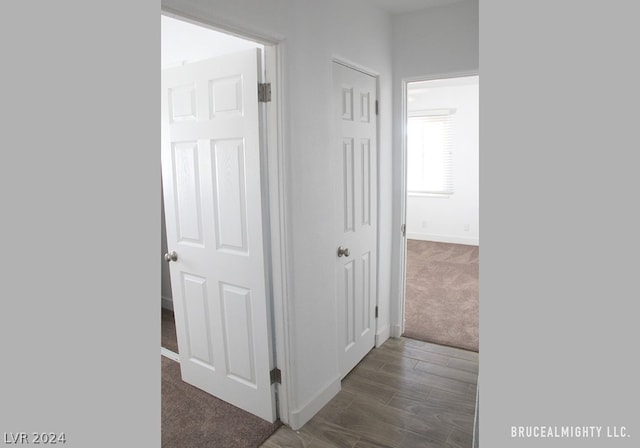 hallway featuring dark wood-type flooring