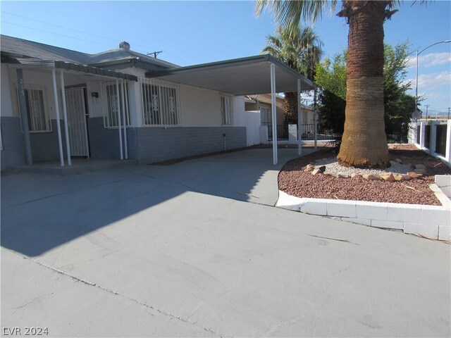 view of front of home featuring a carport