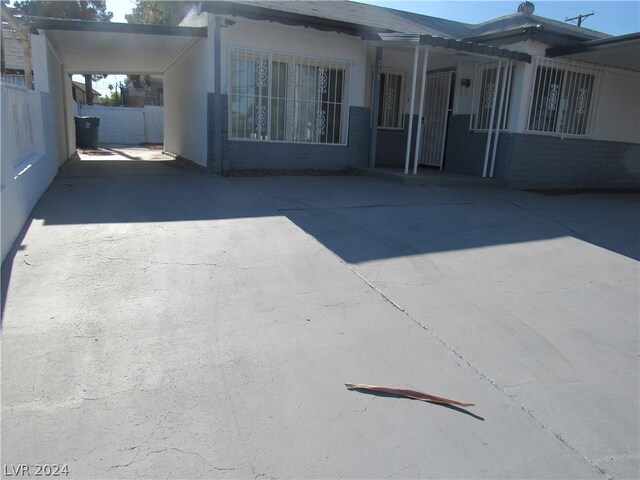 exterior space with a carport