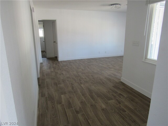 spare room featuring dark wood-type flooring