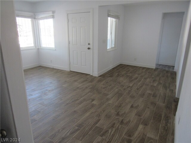 spare room with dark wood-type flooring