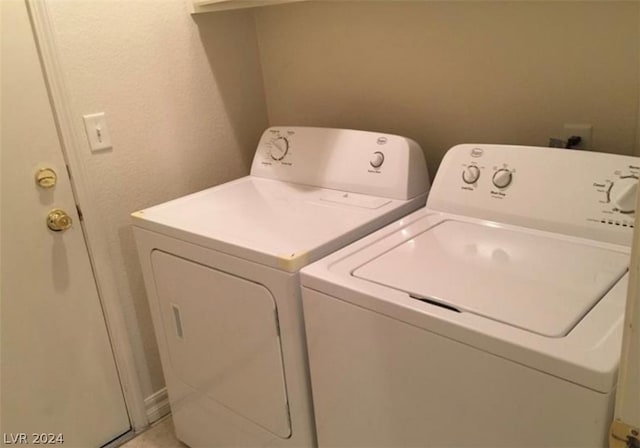 washroom with washer and dryer