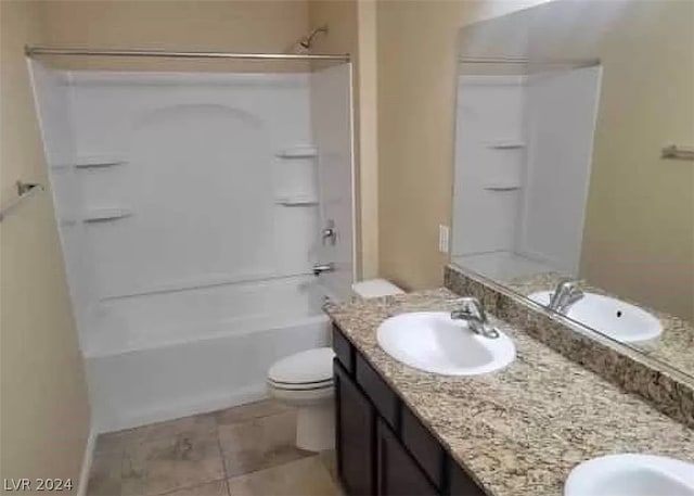 full bathroom featuring tile flooring, toilet, bathtub / shower combination, and dual bowl vanity