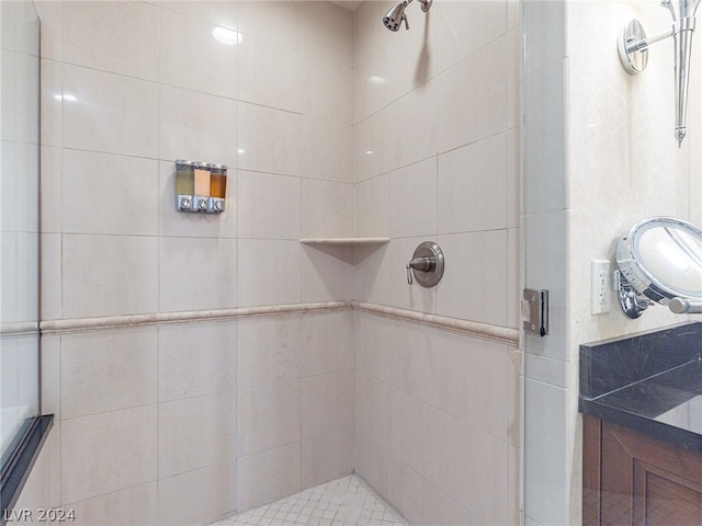 bathroom with tiled shower