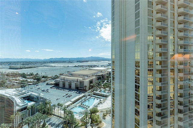 property's view of city featuring a mountain view