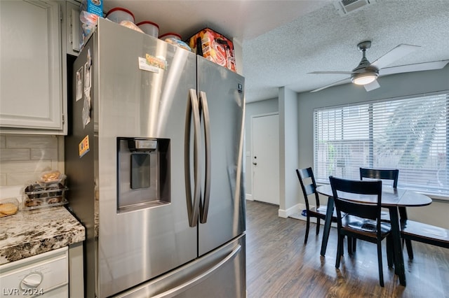 kitchen featuring ceiling fan, white cabinets, tasteful backsplash, dark hardwood / wood-style flooring, and stainless steel refrigerator with ice dispenser