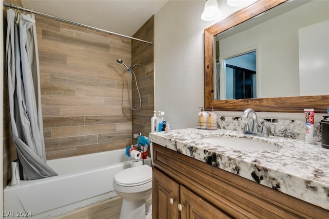 full bathroom featuring shower / bath combination with curtain, vanity, and toilet