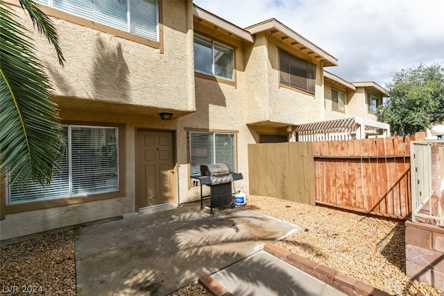 back of property with a patio