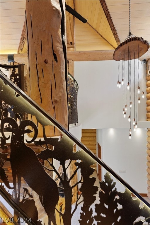 stairs featuring high vaulted ceiling and beam ceiling