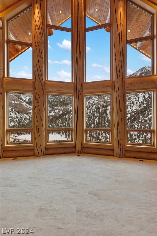 interior space with plenty of natural light and wood ceiling