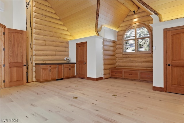 additional living space with rustic walls, wooden ceiling, high vaulted ceiling, and light wood-type flooring