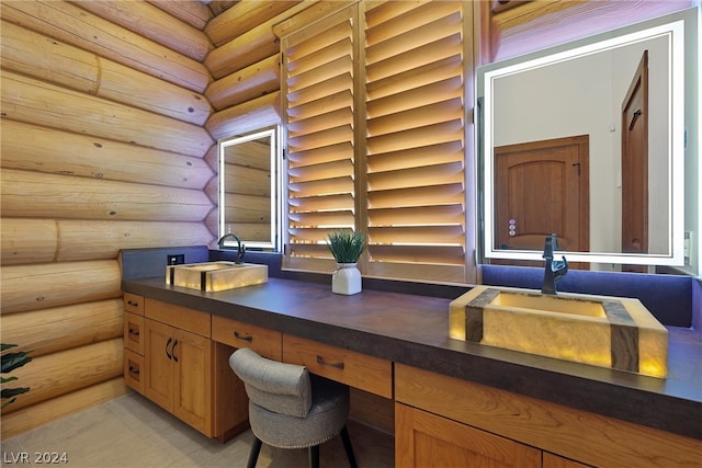 unfurnished office featuring log walls and sink