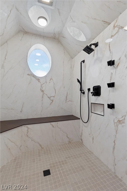 bathroom with a tile shower