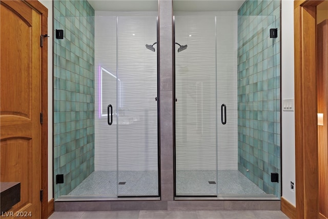 bathroom with walk in shower and tile floors