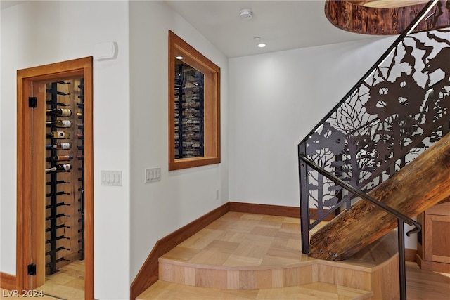 stairway with light parquet flooring