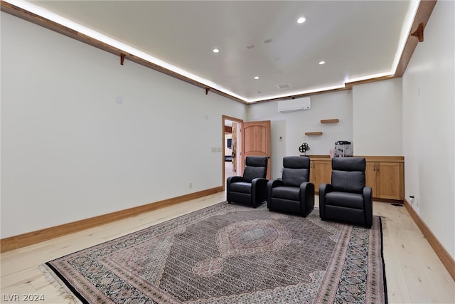 interior space featuring a wall mounted air conditioner and light hardwood / wood-style floors