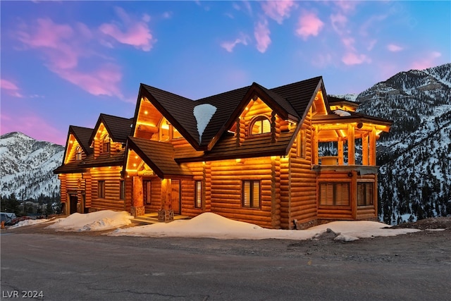 log cabin featuring a mountain view