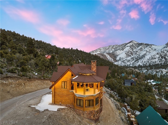 view of front of property with a mountain view