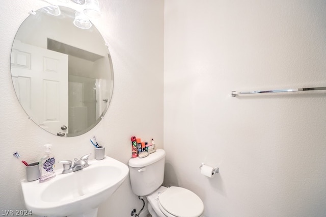 bathroom featuring sink and toilet