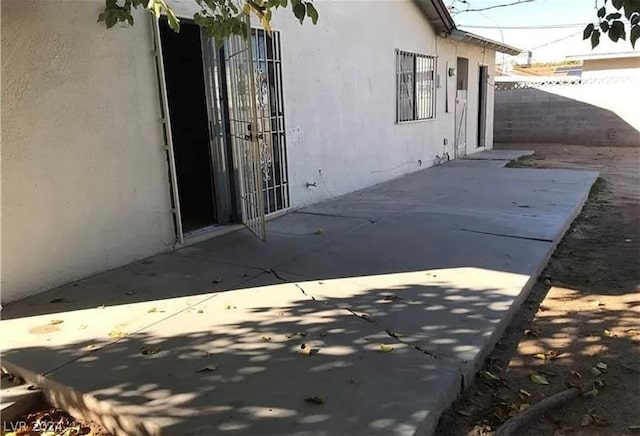 entrance to property with a patio