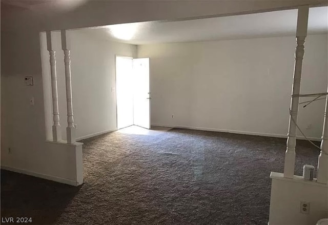 interior space with dark colored carpet