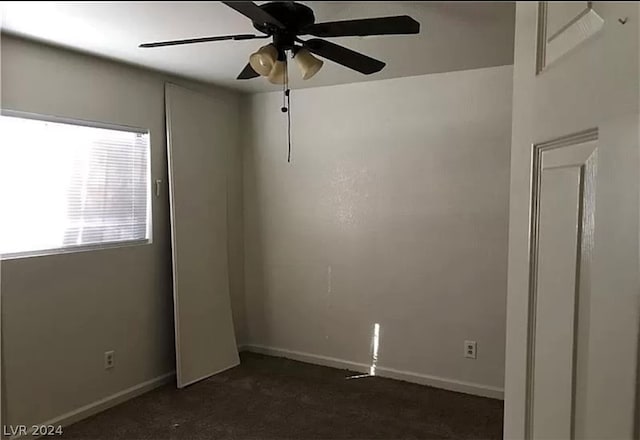 carpeted empty room with ceiling fan