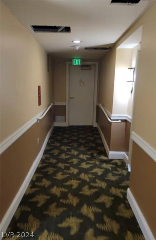 corridor with dark carpet