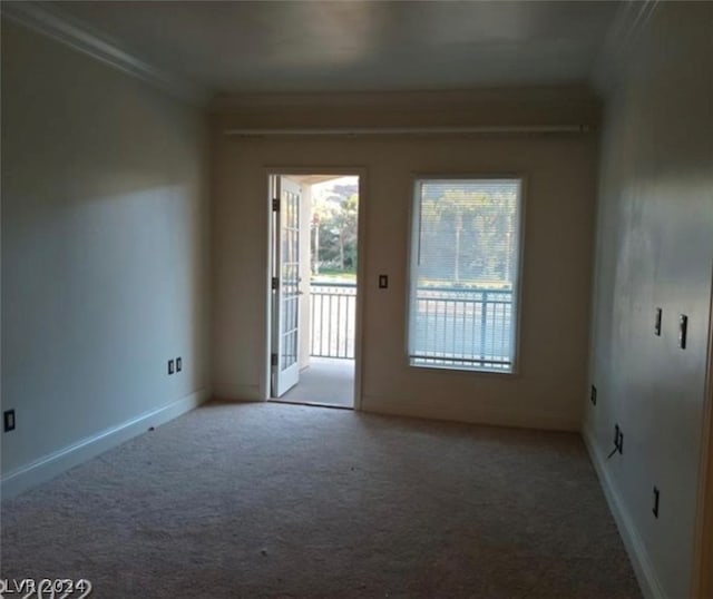 carpeted empty room with ornamental molding