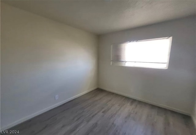 spare room featuring hardwood / wood-style flooring