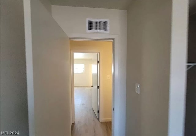 hall with light hardwood / wood-style floors