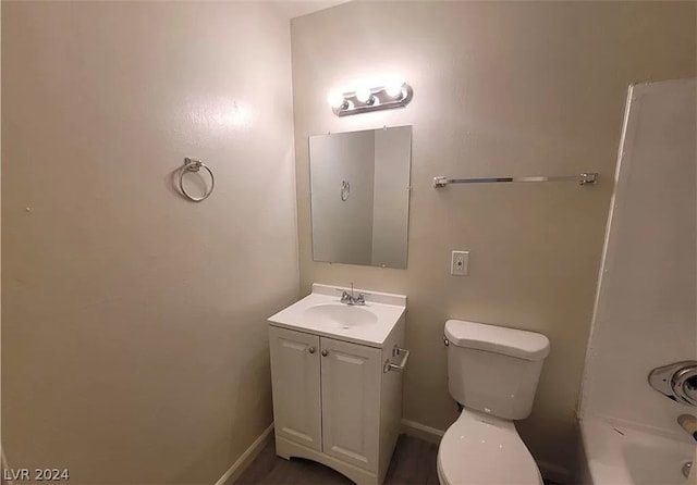 full bathroom featuring toilet, vanity, and shower / bath combination