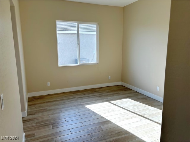 spare room featuring light wood-type flooring