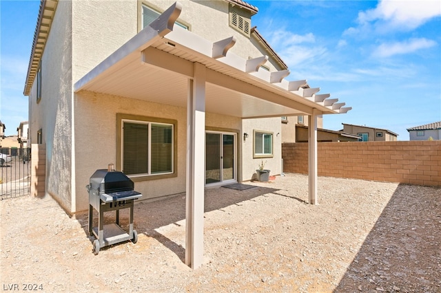 back of property with a patio