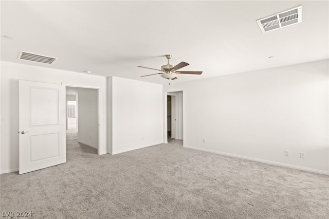 unfurnished room with light carpet and ceiling fan