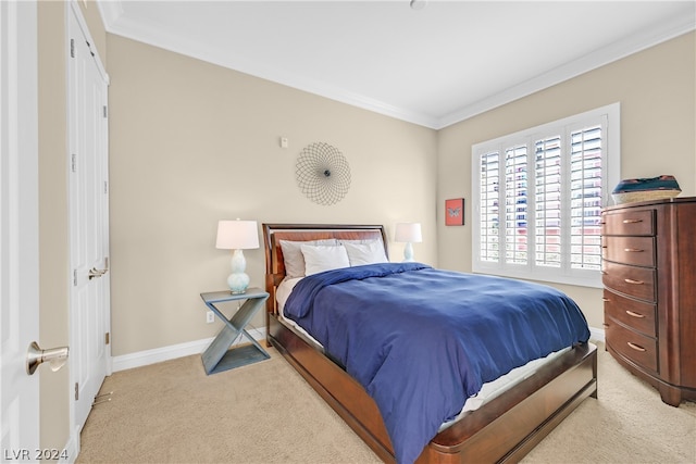 bedroom with light carpet and ornamental molding