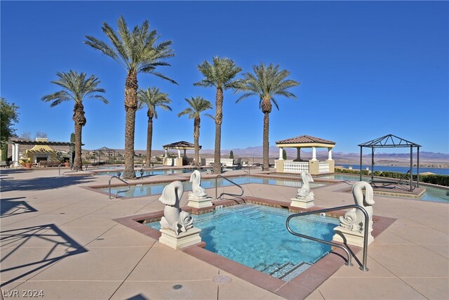 view of pool with a gazebo and a patio area