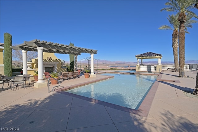 view of pool with a pergola, a gazebo, and a patio