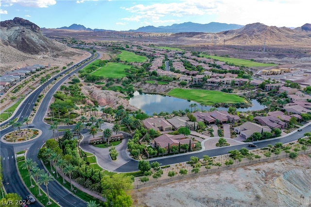 drone / aerial view with a water and mountain view