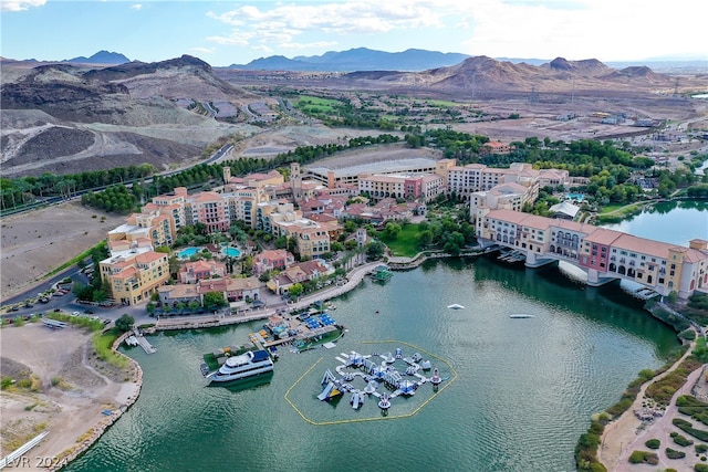 aerial view featuring a water and mountain view