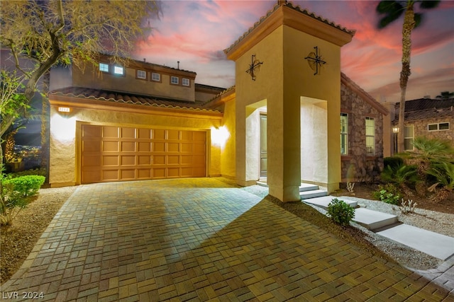 view of front of property featuring a garage